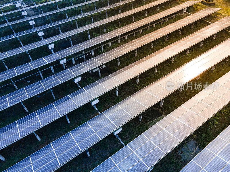 Aerial view of Solar Plant in Bangladesh. Rows of Solar Panels with Sun Reflection. Solar Energy Background. Renewable Energy Background